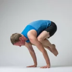 Jason Crandell in Crow pose