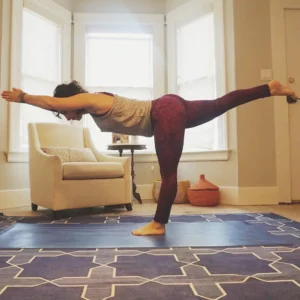 Andrea Ferretti in a yoga pose