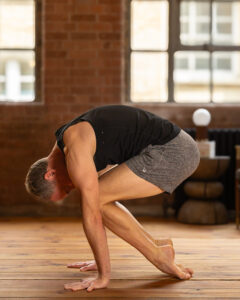 Jason Crandell in Bakasana