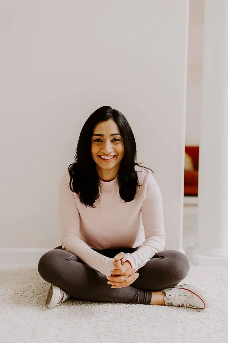 Arundhati Baitmangalkar sitting crossed legged on the floor