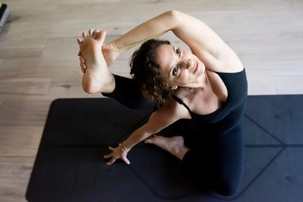 Andrea Ferretti in a yoga pose
