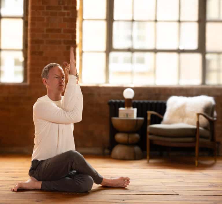 Jason seated with Garudasana arms