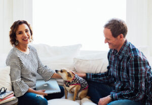 Andrea Ferretti and Jason Crandell with a dog