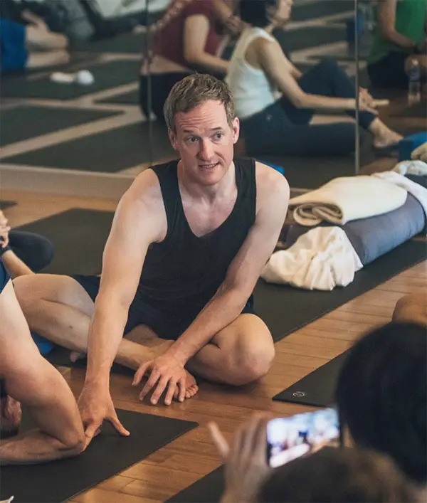Jason Crandell talking during yoga class