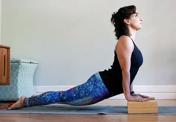 7 Yoga Moves to Relieve Back Pain - Camille Styles